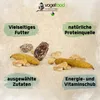 A marketing image showing bird food with descriptive text boxes. Produktbild-Vorschau