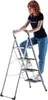 A woman is standing on a step ladder. Náhľad obrázku produktu