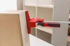 A clamp is shown holding together two pieces of wood, likely for furniture assembly. Náhľad obrázku produktu