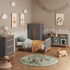 A child's bedroom with a bed, dresser, and storage unit. Náhled obrázku produktu