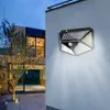 A solar-powered motion-sensing light is mounted on the exterior wall of a modern house at dusk. Produktbild-Vorschau