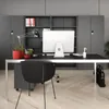 A modern office desk with a computer and accessories in front of storage cabinets. Podgląd zdjęcia produktu