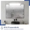 A bathroom mirror with a light fixture above it, a sink below, and text describing its features. Anteprima dell’immagine prodotto