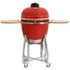 A red ceramic kamado grill on a silver stand with wooden side shelves, presented against a white background. Produktbild-Vorschau