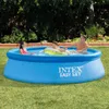 A family is enjoying themselves in an Intex Easy Set swimming pool on a sunny day. Anteprima dell’immagine prodotto