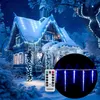 A snowy house decorated with blue LED icicle lights for Christmas. Produktbild-Vorschau