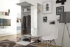 A modern hallway with a white wardrobe and mirror, a white chair, and a floor lamp. Produktbild-Vorschau
