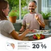 A couple enjoying a meal together outdoors, with the man using a specialized utensil. Produktbild-Vorschau