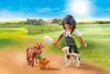 A Playmobil figure is feeding a goat and a kid in a sunny rural setting. Produktbild-Vorschau