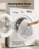 A person is putting a cover into a washing machine. Produktbild-Vorschau