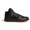 A black Adidas Hoops 3.0 Mid sneaker with a gum sole is shown against a white background. Voir les images du produit