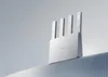 A white Xiaomi router with four antennas is placed on a ribbed surface against a light gray background. Náhľad obrázku produktu
