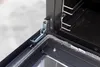 Close-up of a stove door hinge and seal. Produktbild-Vorschau