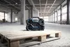 A construction site with a radio on a wooden pallet. Produktbild-Vorschau