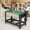 A boy and a girl are playing with a multi-game table in a room with bookshelves. Anteprima dell’immagine prodotto