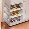 A close-up view of a kitchen cart with a wine rack filled with bottles. Voir les images du produit