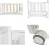 A collage of four images showing different views of a white baby crib. Produktbild-Vorschau