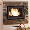 A fireplace insert with a marble surround, with a basket of logs in the foreground. Produktbild-Vorschau