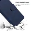 A blue phone case is shown falling onto a cracked surface, illustrating its shock-resistant feature. Produktbild-Vorschau