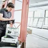 A man is working with tools in a room with windows. Produktbild-Vorschau