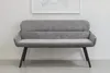 A gray upholstered bench with black legs is shown against a white wall with a framed picture above it. Produktbild-Vorschau