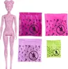 A doll and four mystery bags are displayed against a white background. Anteprima dell’immagine prodotto