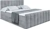A gray upholstered boxspring bed with a headboard and footboard, made up with white bedding and a gray throw blanket. Produktbild-Vorschau