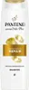 A white bottle of Pantene shampoo with gold accents and text. Podgląd zdjęcia produktu