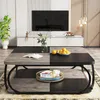 A living room scene featuring a coffee table with decorative items, a TV stand, and a television. Podgląd zdjęcia produktu