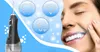 A woman is smiling with her eyes closed while using a water flosser on her teeth. Icons representing a tooth, a diamond, and a lightbulb are displayed in the background. Voir les images du produit
