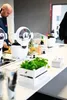 A man is preparing food in a kitchen with a smart multi-cooker. Podgląd zdjęcia produktu