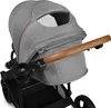 A close-up view of a gray stroller's canopy and handle. Anteprima dell’immagine prodotto