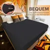 A dark gray fitted sheet is spread over a bed with pillows. Produktbild-Vorschau