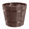 A brown Christmas tree stand designed to look like a wooden barrel. Voir les images du produit