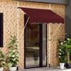 A burgundy awning is installed over a glass door on a brick wall, with potted plants on either side. Náhled obrázku produktu