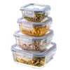 A stack of four glass food storage containers filled with different food items. Produktbild-Vorschau