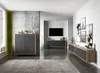 A modern living room with a TV stand, cabinets, and decorative items. Produktbild-Vorschau