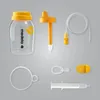 A collection of Medela breast milk feeding accessories laid out on a gray background. Produktbild-Vorschau
