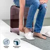 A person is sitting on a transparent mauve stool and putting on slippers. Anteprima dell’immagine prodotto