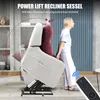 A woman is standing next to a power lift recliner chair that is shown in a partially reclined and lifted position. Anteprima dell’immagine prodotto