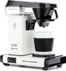 A white Moccacoffee maker with a black filter holder and a white mug with a black sleeve. Produktbild-Vorschau