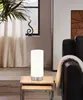A modern living room scene with a table lamp on a side table next to a sofa. Náhľad obrázku produktu