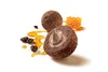 A cut-open chocolate truffle with a creamy filling, next to a whole truffle, coffee beans, and honeycomb with honey. Produktbild-Vorschau