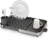 A dish rack with various kitchen utensils. Voir les images du produit