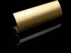 A close-up studio shot of a single bronze-colored door handle, reflecting on a black surface. Produktbild-Vorschau
