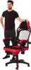 A man standing next to a red and black gaming chair. Produktbild-Vorschau
