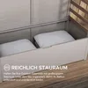 An open storage box with two pillows inside, placed on a wooden deck. Náhled obrázku produktu