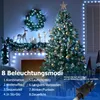 A decorated Christmas tree and fireplace with Christmas lights, showcasing different lighting modes. Produktbild-Vorschau