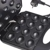 A close-up view of an open electric waffle maker with multiple round indentations for baking. Anteprima dell’immagine prodotto