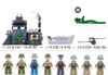 A collection of building block toy sets, including a fort, a boat, a cannon, and several soldier figures, along with a green alligator toy and a logo. Podgląd zdjęcia produktu